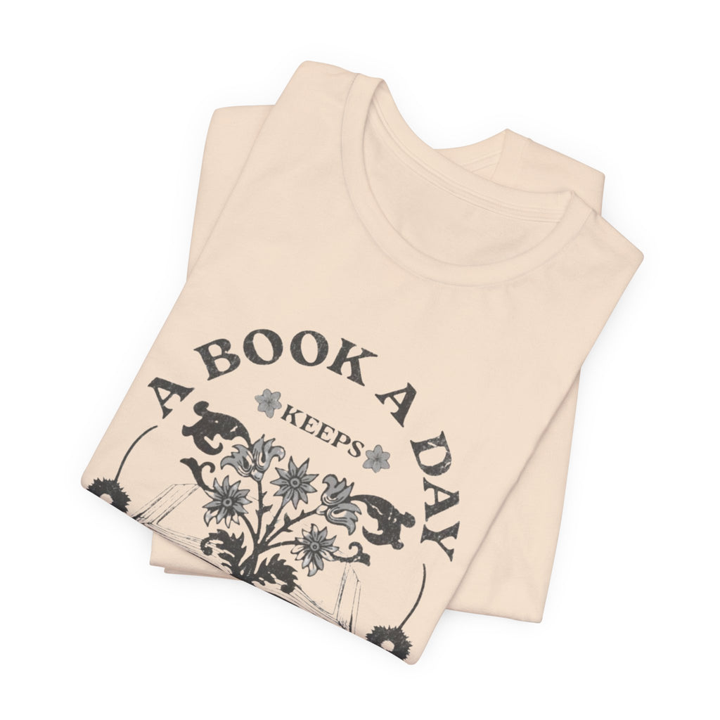 A Book A Day Keeps Reality Away T-Shirt | Reading Floral Illustration